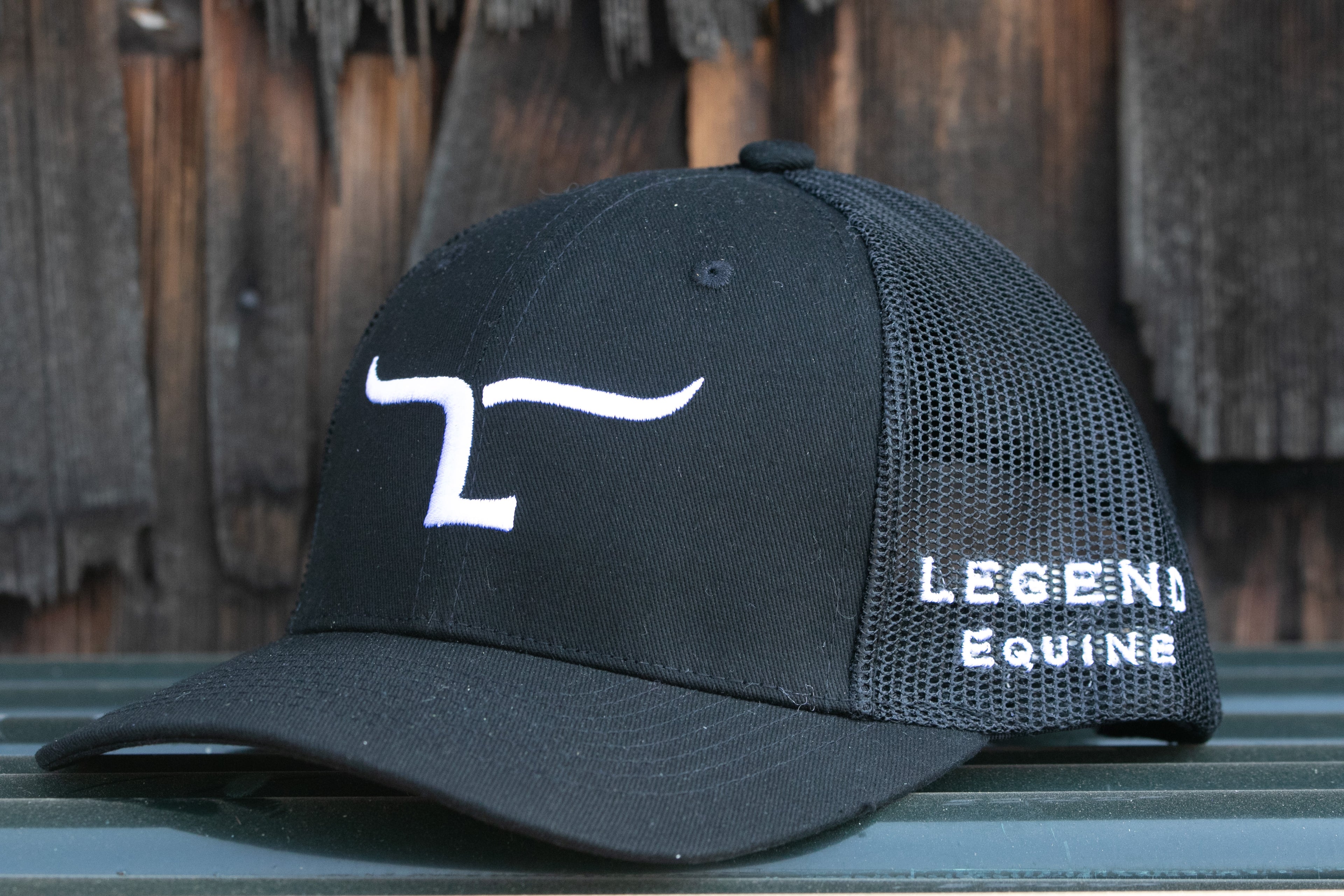 Black baseball style Legend Equine hat with white writing