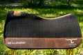 Black Legend Equine saddle pad with brown wear leathers saddle pad with 'Be a Legend' branding