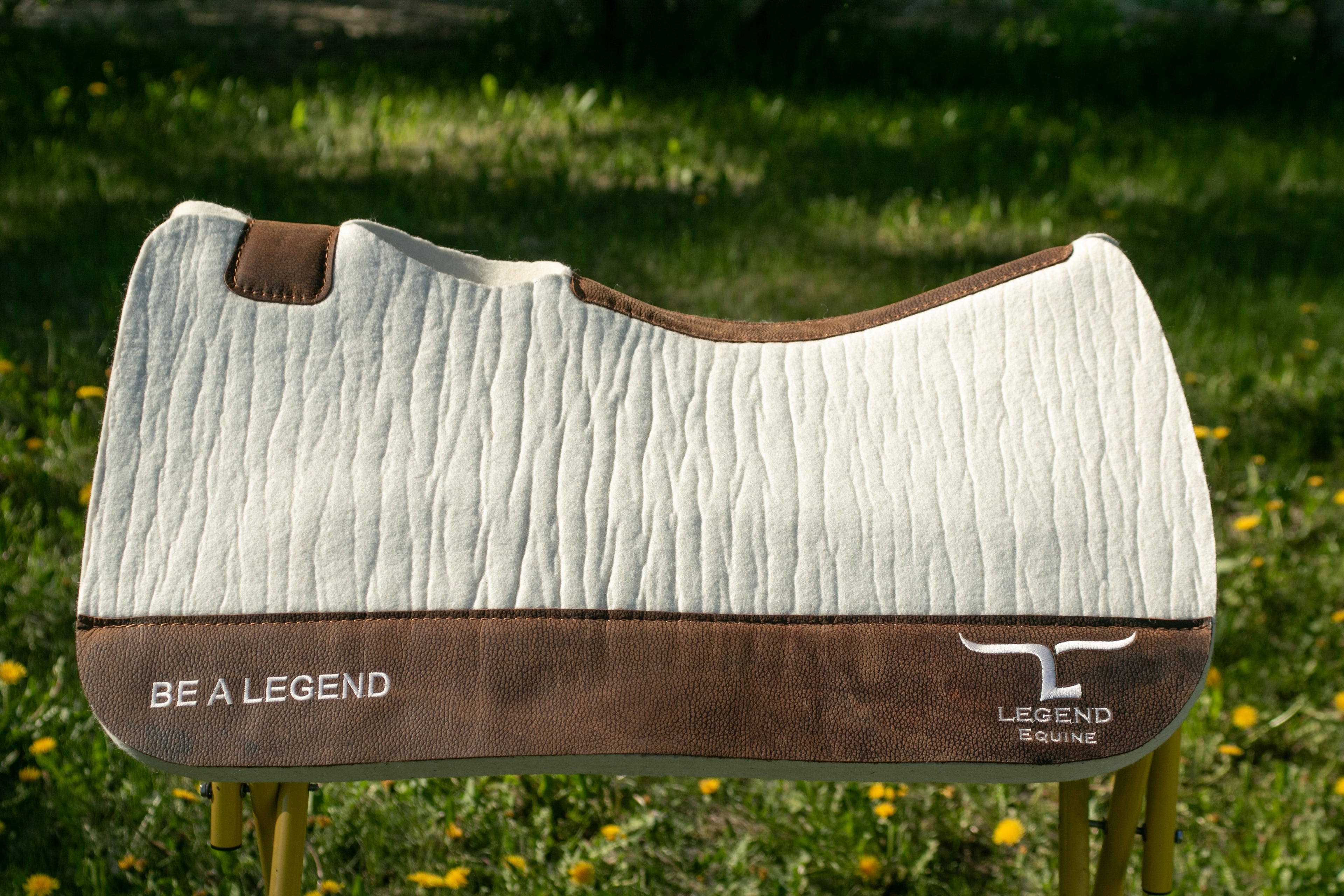 Natural with brown wear leathers saddle pad with Be A Legend writing